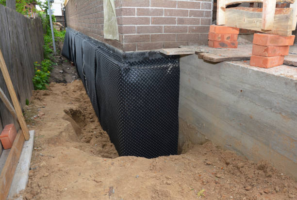 SJ Waterproofing Pros technician performing targeted Interior Drainage System assessment in Maize, KS